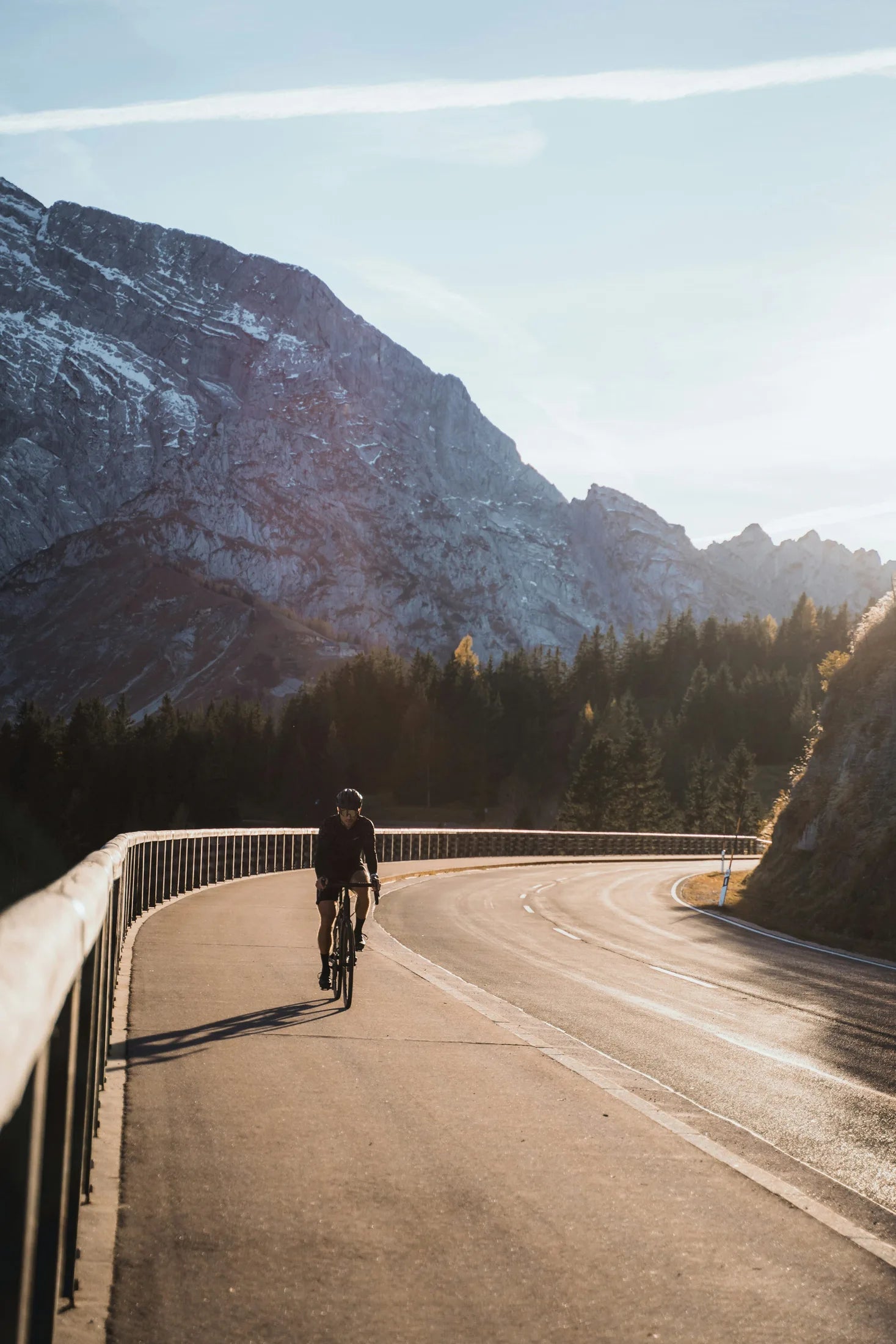 Cyclist riding alone on a mountain road